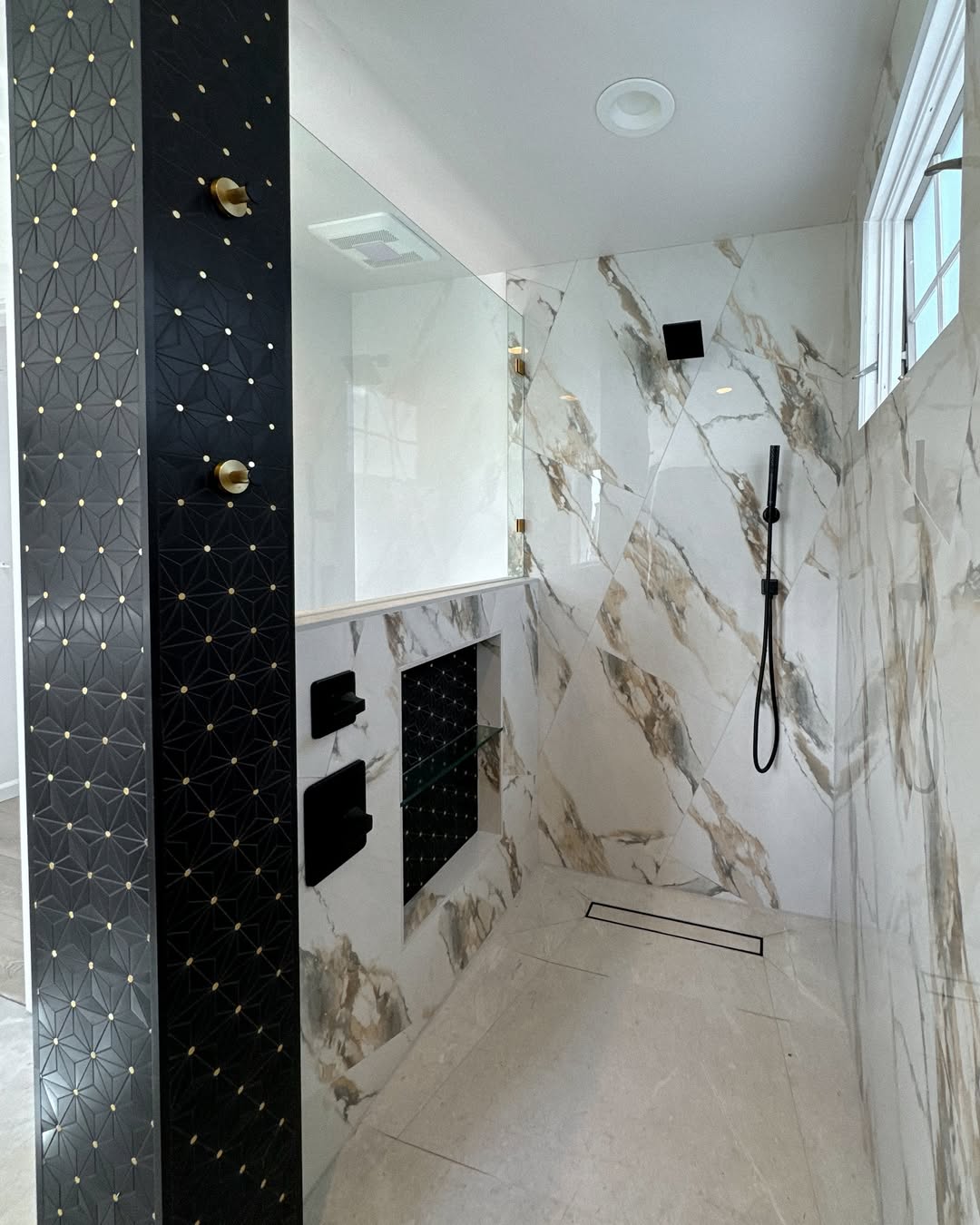 Dramatic Black Geometric Tile Accent Wall