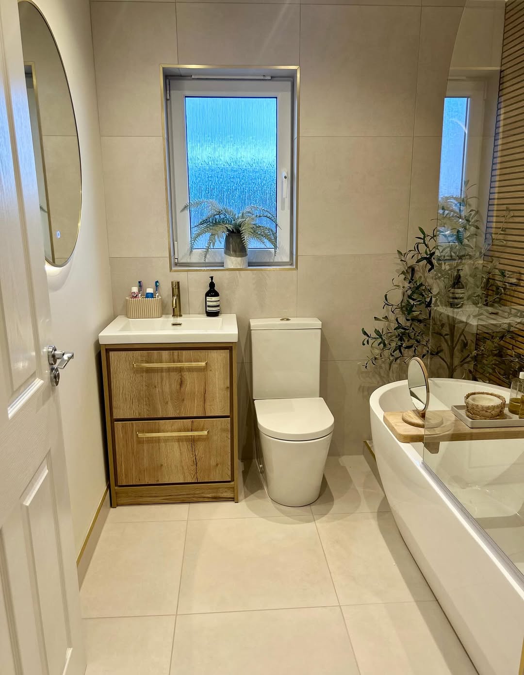 Warm Up Your Vanity with Wood Grain and Gold Hardware