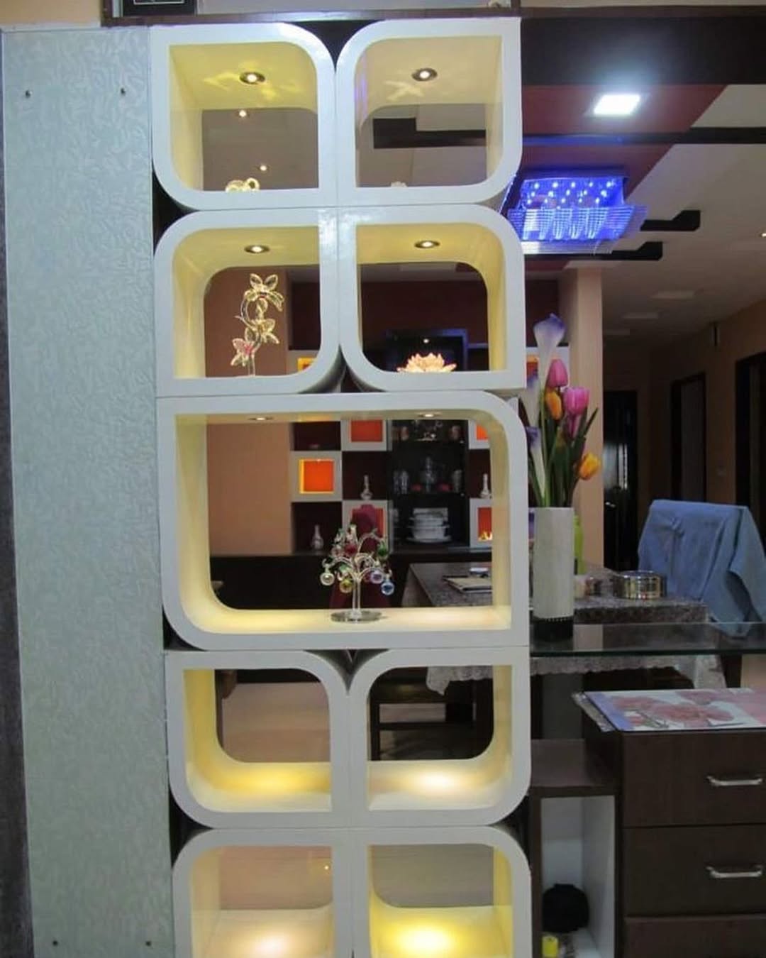 Curved Cubby Shelving With Integrated Spotlights