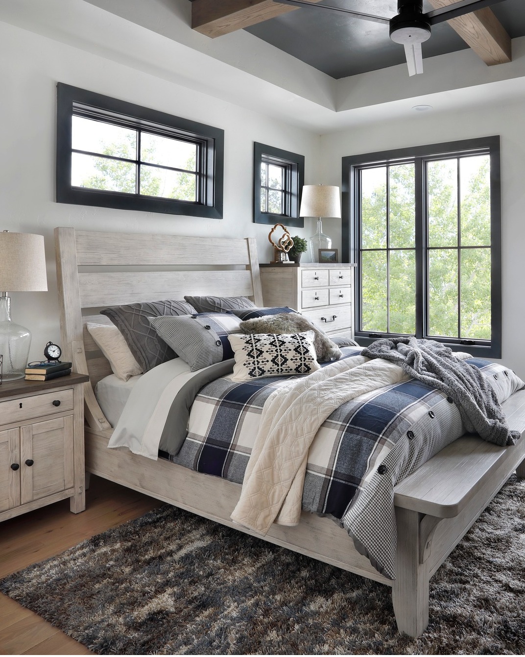 Wooden Bench At Foot Of Bed Adds Casual Seating