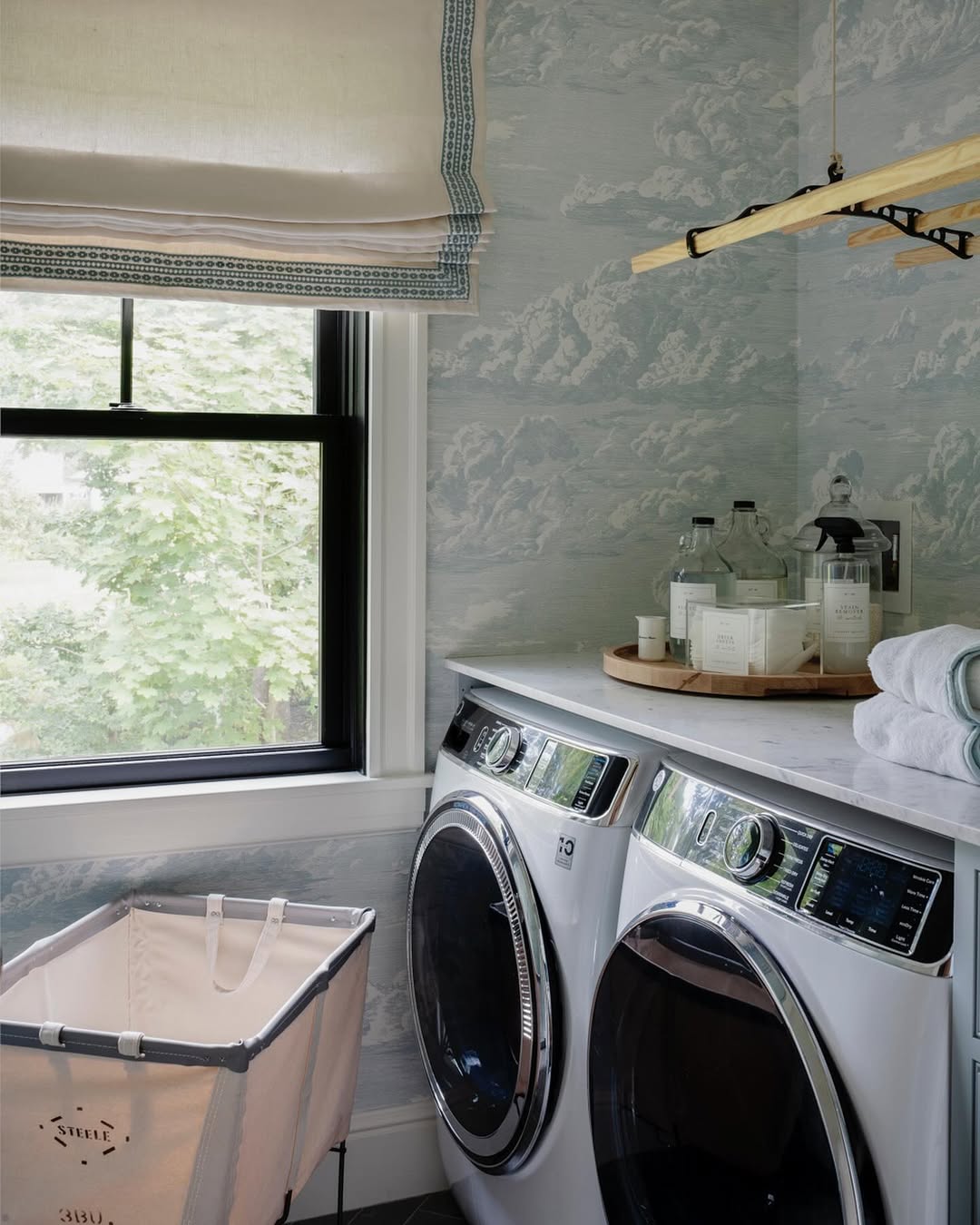Cloudscape Wallpaper Creates a Serene Laundry Room Backdrop