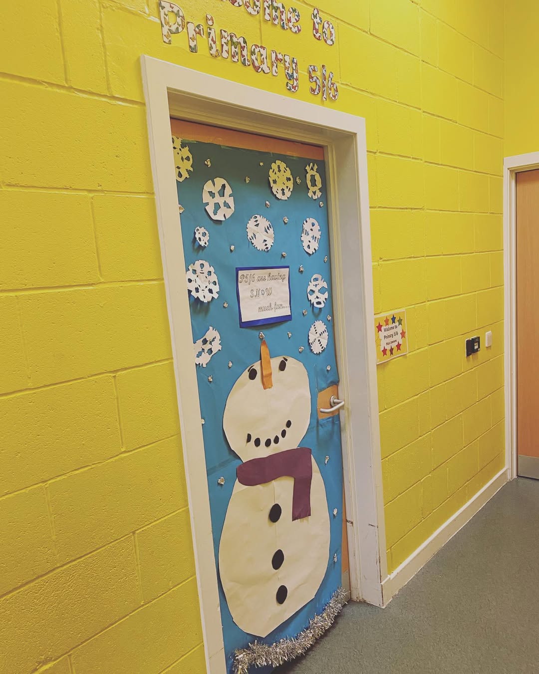 Giant Snowman Door with Paper Snowflakes
