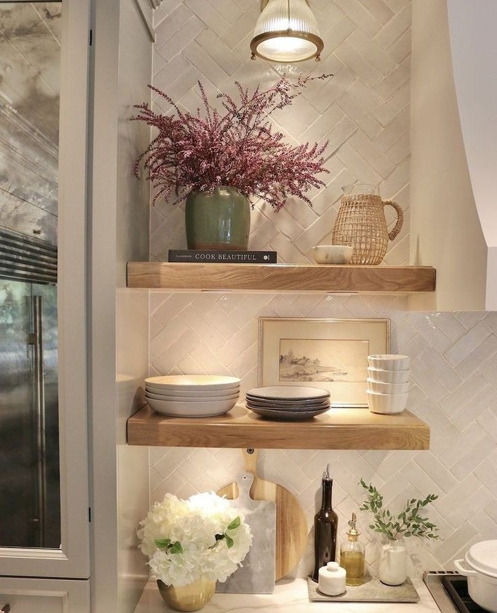 Wooden Shelves Displaying Stacked Dishes and Artwork