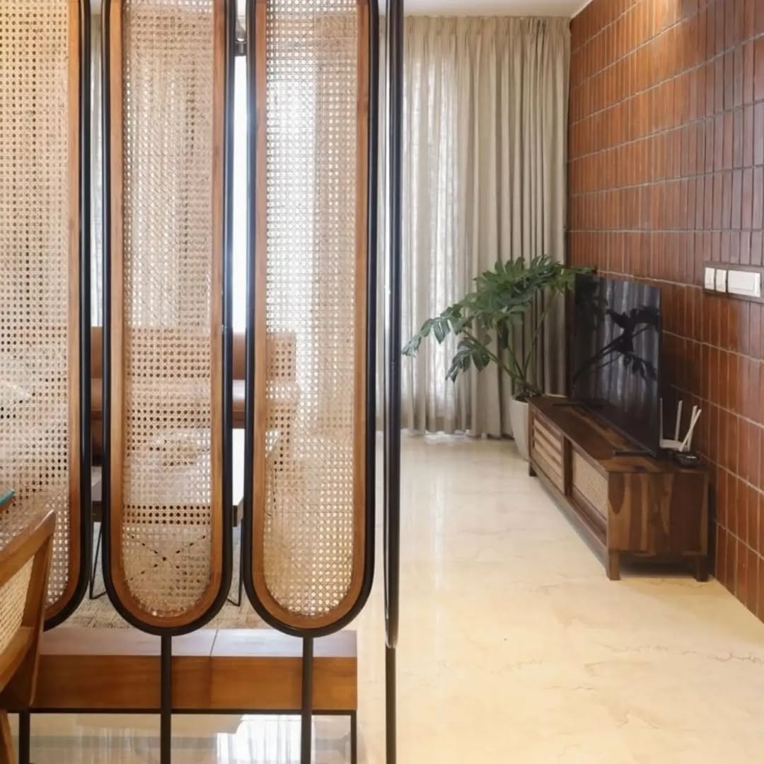 Rattan and Wood Screens With Rounded Edges Define Spaces