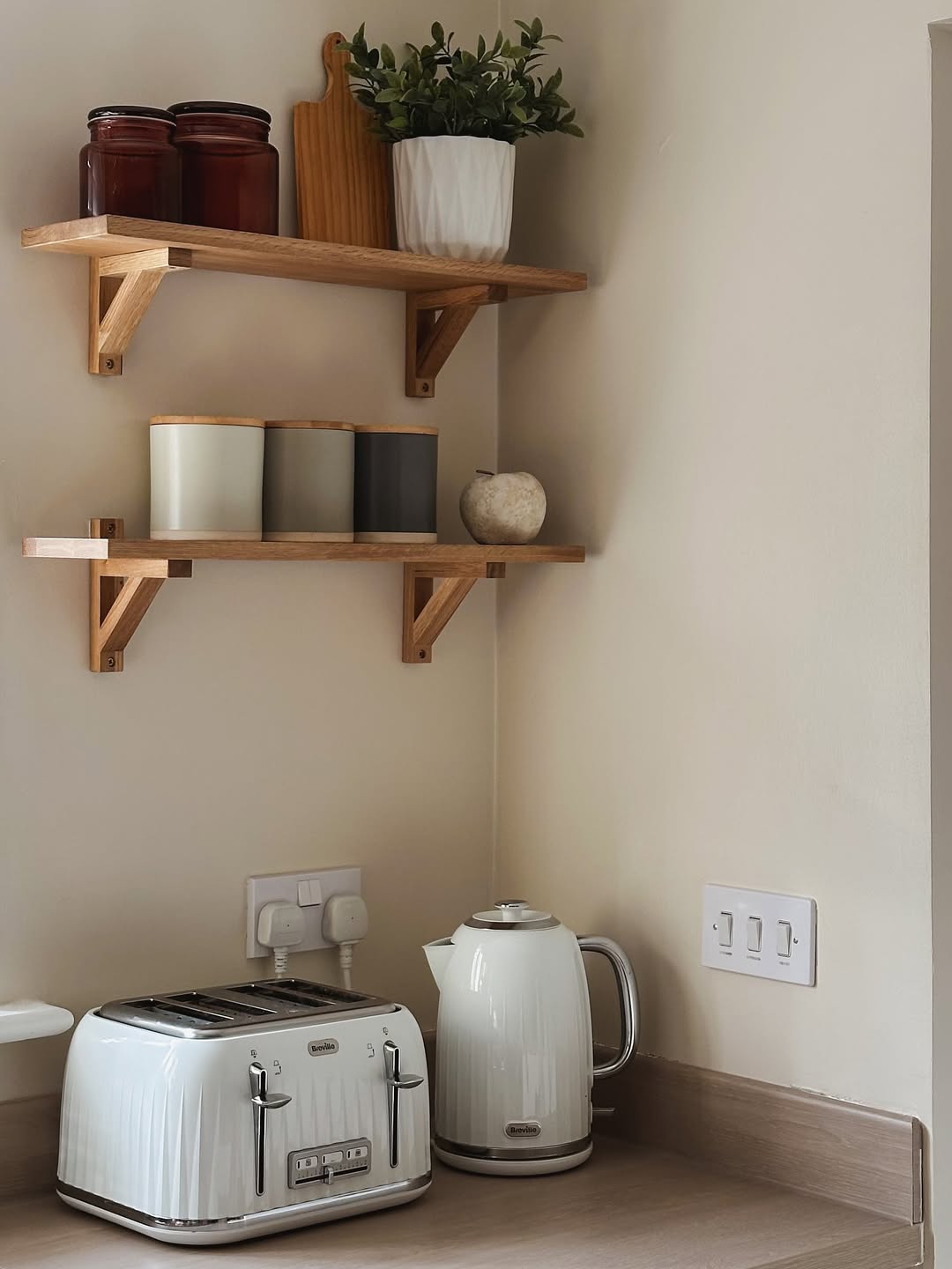 Neutral Cylindrical Canisters With Wood Lids Add Calm