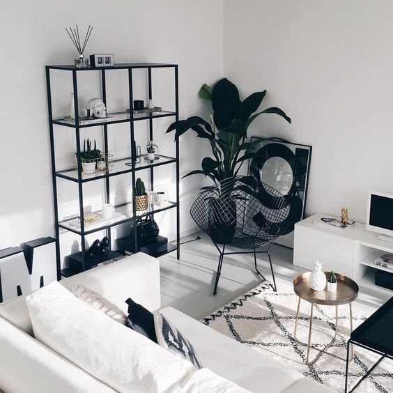 Black Wire Chair Adds Graphic Silhouette To A Green Plant
