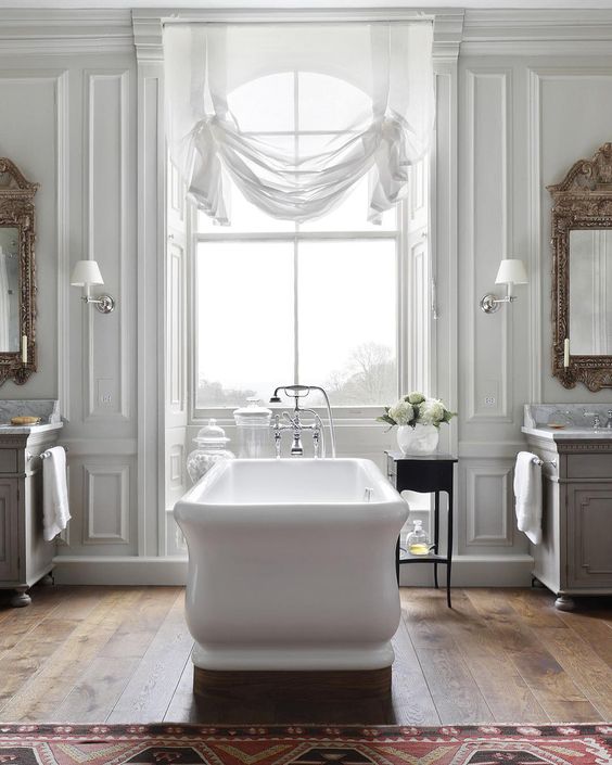 Freestanding Tub with Ornate Side Table for Bath Essentials