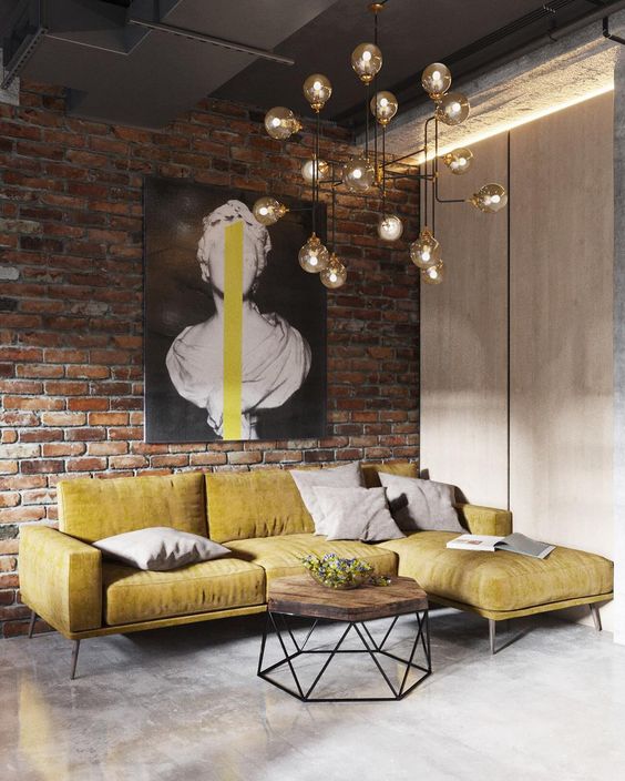 Bold Yellow Sofa Anchors a Brick Wall Living Room