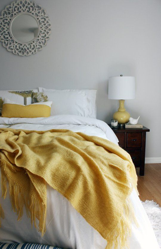 Sunny Yellow Throw Adds Warmth to a Grey Bedroom