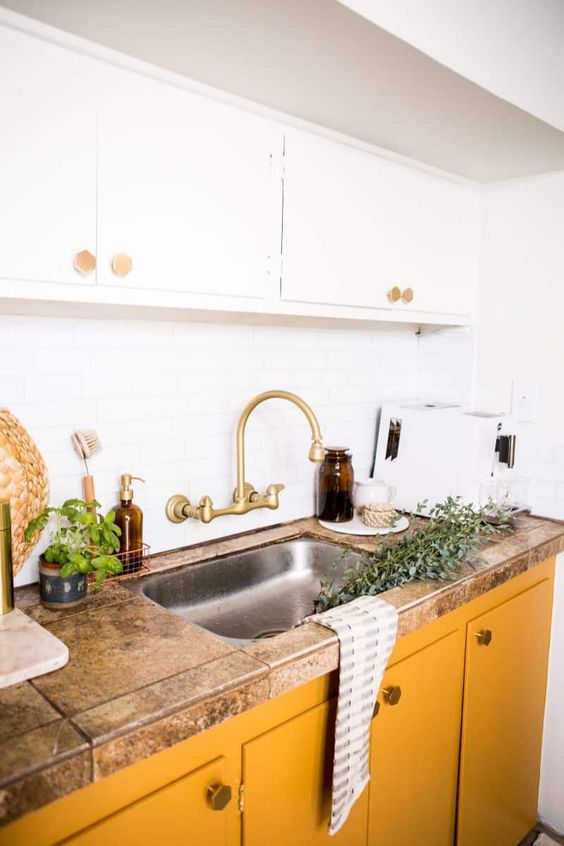 Warm Metallic Accents with Brass Faucet and Hexagon Knobs