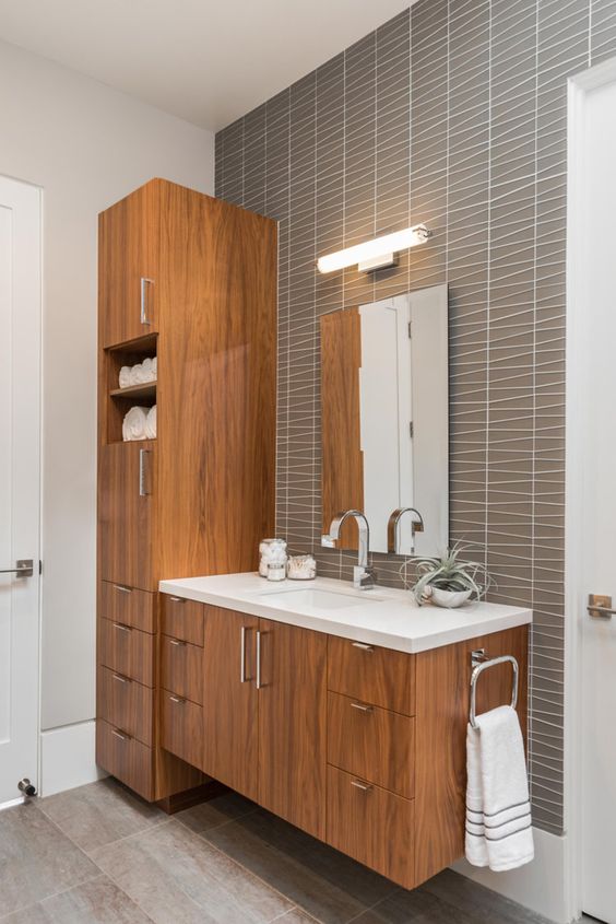 Tall Walnut Cabinet Offers Open Shelves for Rolled Towels