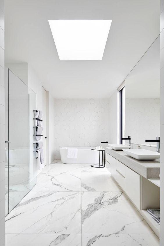 Hexagon Tile Walls Add Subtle Geometric Texture Behind the Tub
