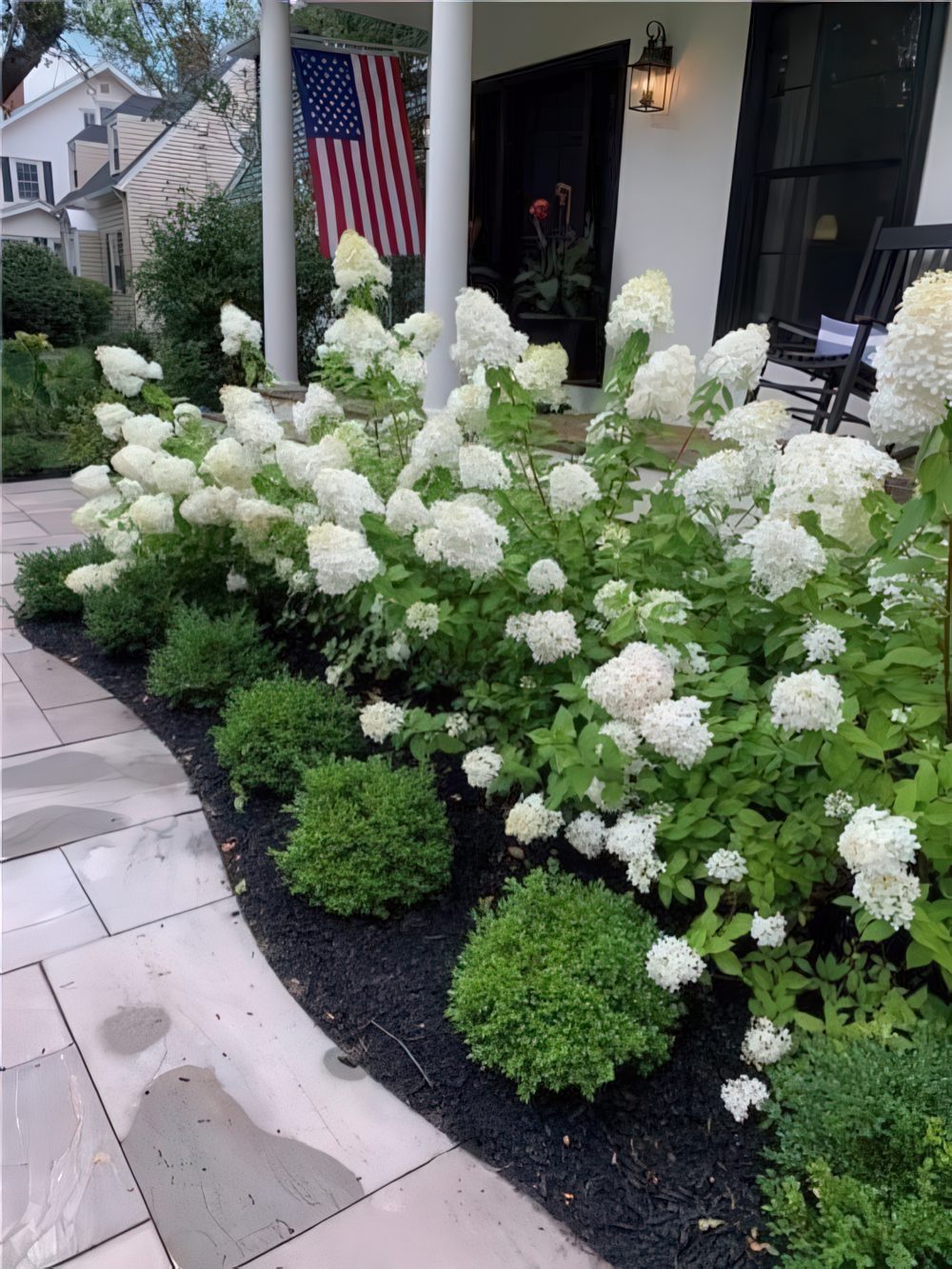 Layered Greenery Frames Tall White Hydrangeas