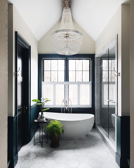Tall Plants Add Life Beside Freestanding Tubs