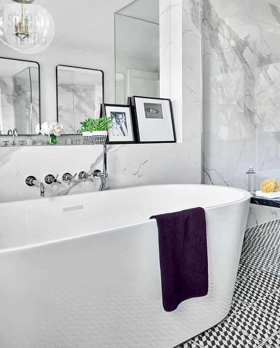 Framed Photos Add Personal Touches Above the Vanity Ledge