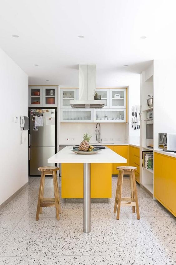 Narrow White Island with Yellow Base Offers Seating