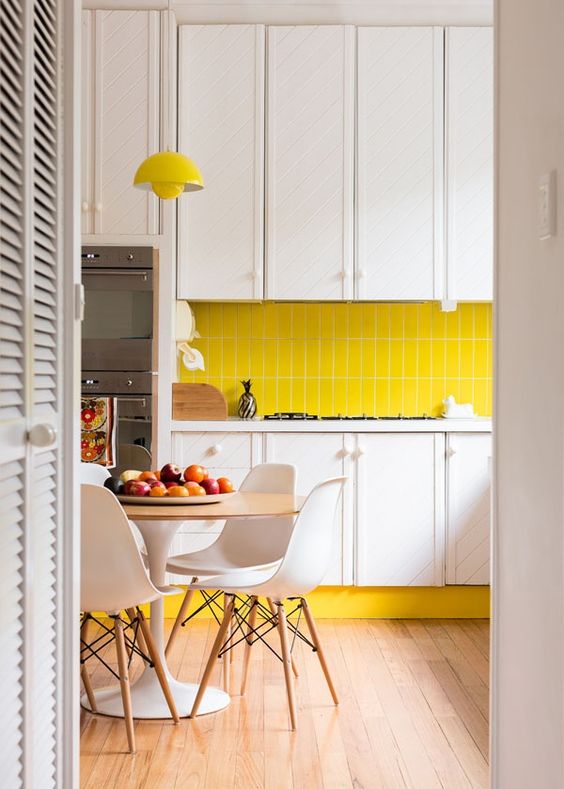 Yellow Baseboard Adds a Sunny Border to White Cabinets