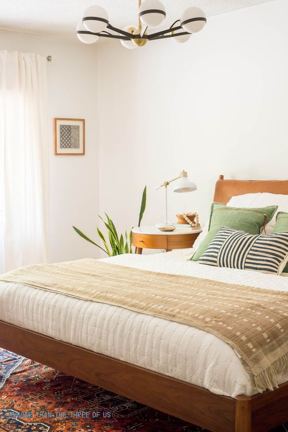 Small Framed Art Adds Geometric Interest Above a Bed