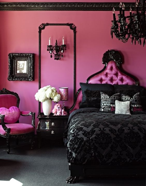 Ornate Black Mirror Frame Highlights Wall Sconce