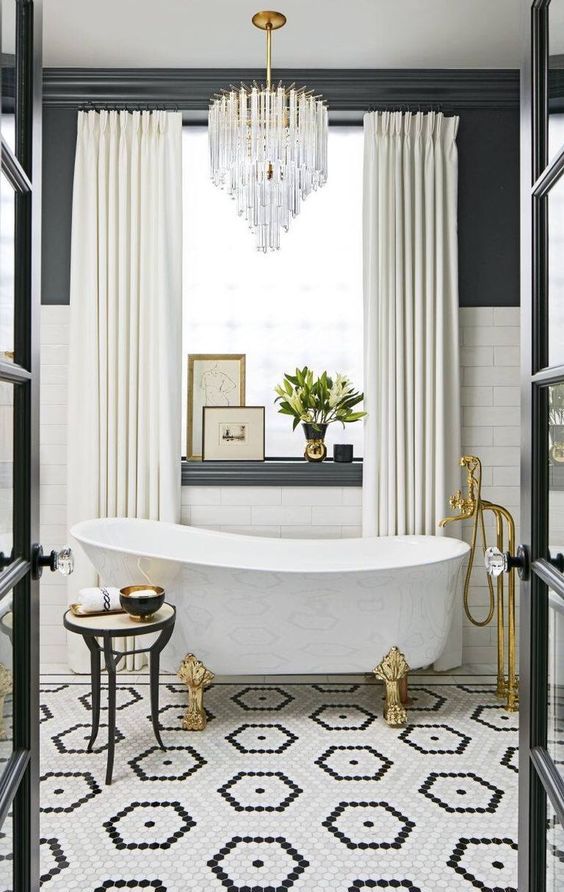 Framed Art Pieces Add Visual Depth Above the Bathtub Ledge