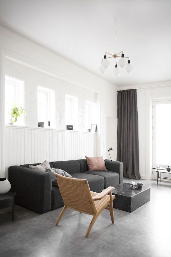 Soften a Charcoal Sofa with a Woven Cane Chair