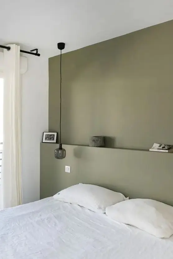 Narrow Shelf Displays Minimalist Decor Above the Bed