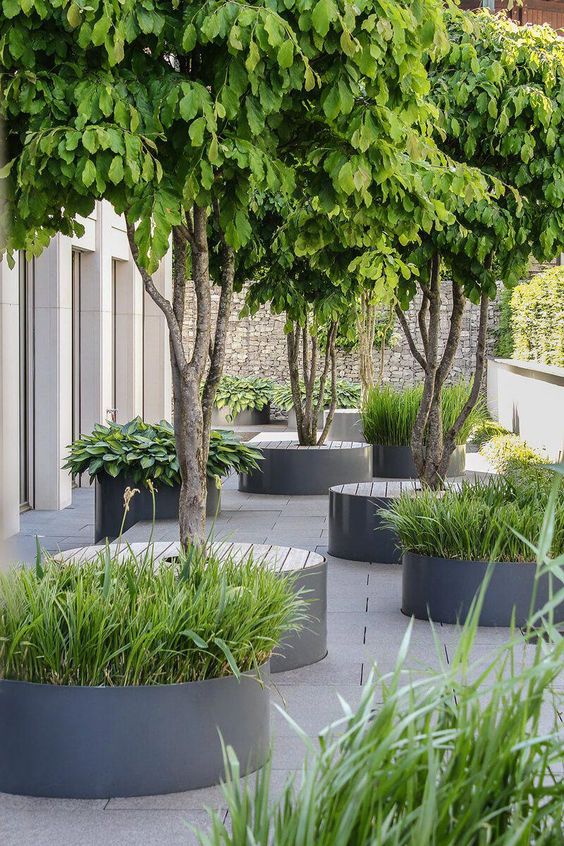 Integrate Seating and Greenery with Circular Planter Benches