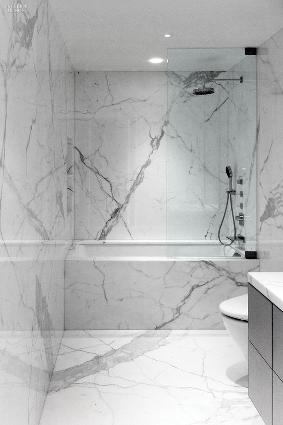 Marble Slab Shower Walls Create a Seamless, Spa-Like Enclosure