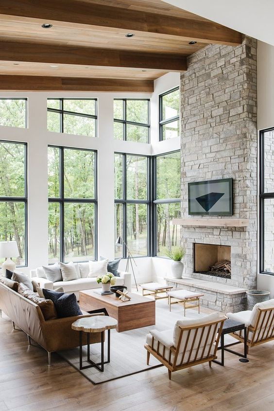 Stone Fireplace With Floating Wood Mantel Displays Art