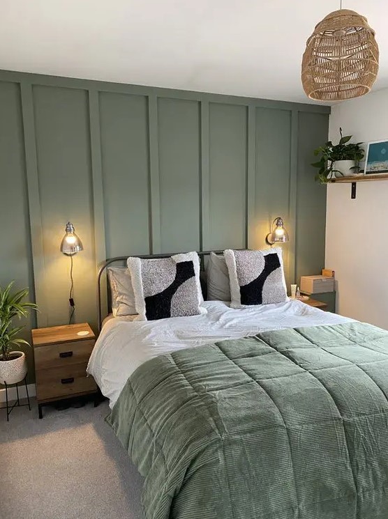 Paneled Green Wall Creates a Subtle Backdrop for Bedside Lamps