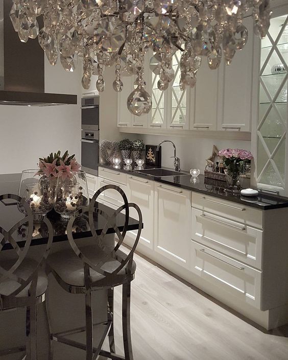 Clear Glass Vases Hold Candlelit Arrangements