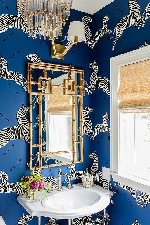 Bamboo-Style Gold Mirror Adds Chic Detail Over Pedestal Sink