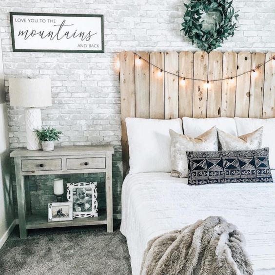 Wooden Pallet Headboard With String Lights Adds Cozy Ambiance