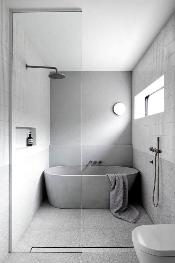 Concrete Tub Adds a Sculptural Element to a Minimalist Bathroom