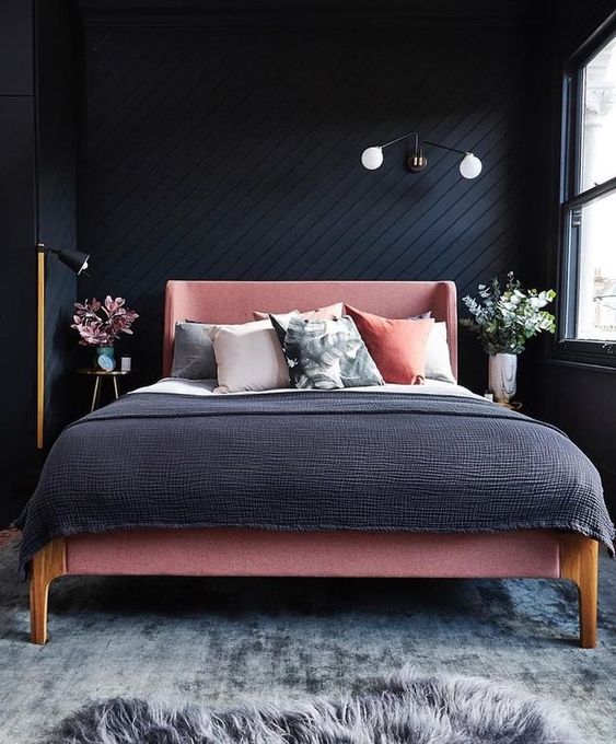 Pink Bed Frame Adds Softness to Dark Walls