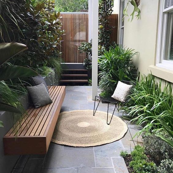 Soften a Modern Stone Patio with a Round Jute Rug