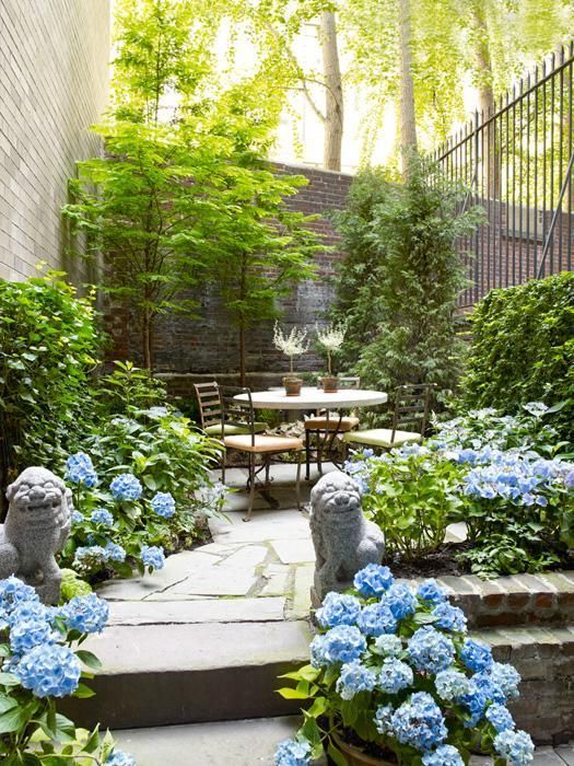 Frame a Path with Stone Lion Statues and Blue Hydrangeas