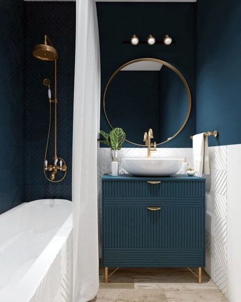 Fluted Teal Vanity with Gold Legs Grounds the Space