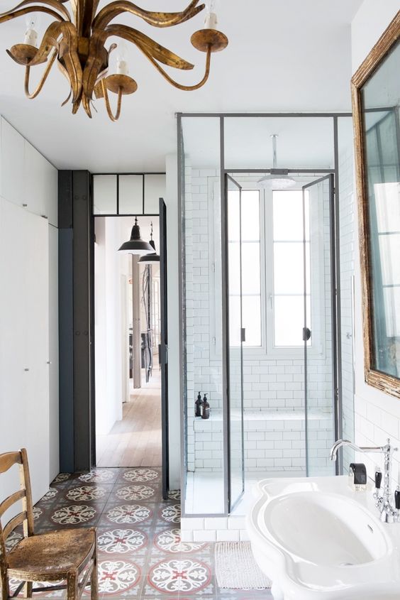 Ornate Chandelier Adds Vintage Glamour Above the Bathroom