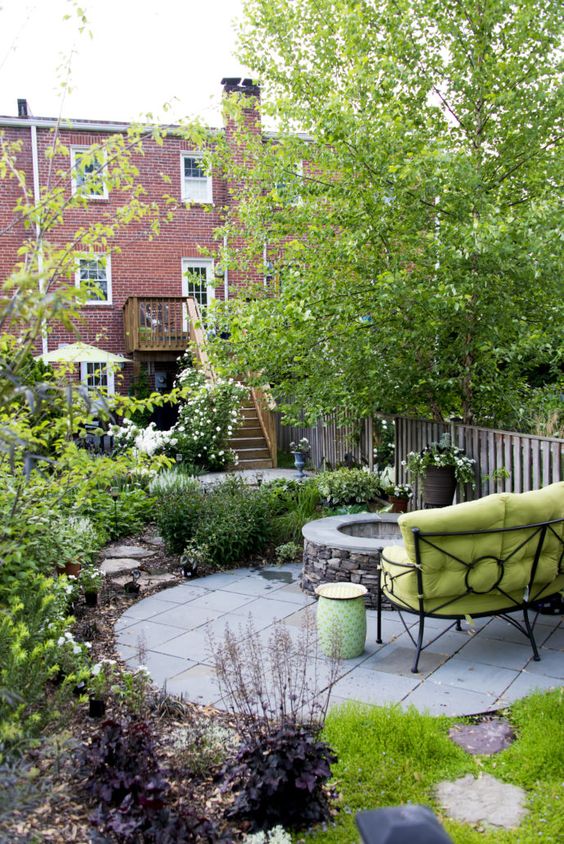 Gather Around a Stone Fire Pit with a Bright Metal Bench