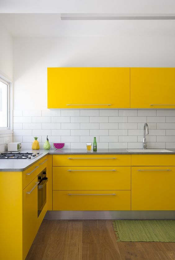 Yellow Cabinets with Sleek Silver Bar Pulls