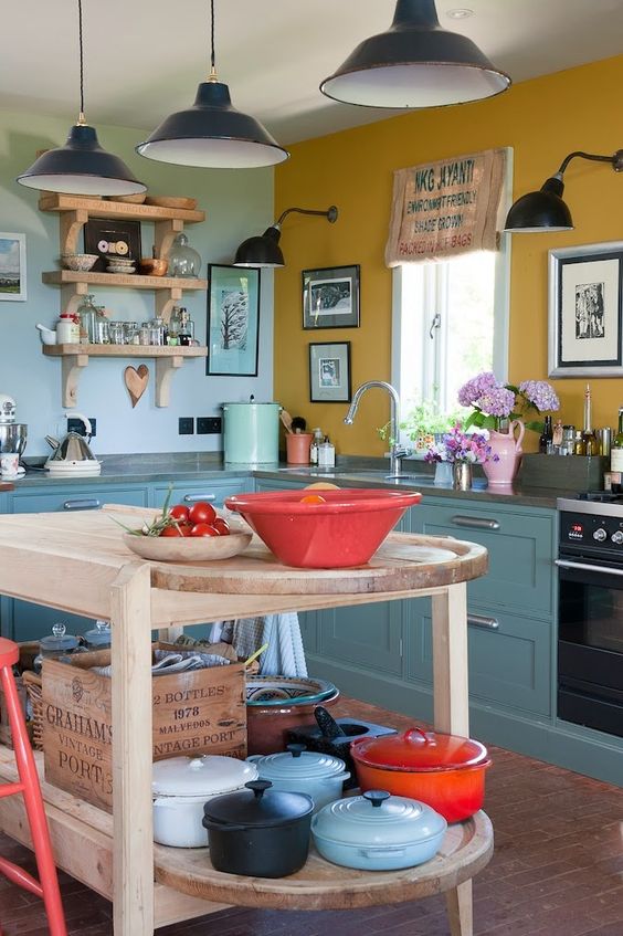 Tiered Wooden Kitchen Island Displays Colorful Cookware