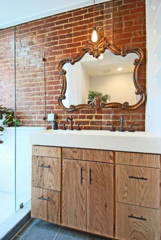 Ornate Mirror Adds Vintage Charm Above a Brick Vanity