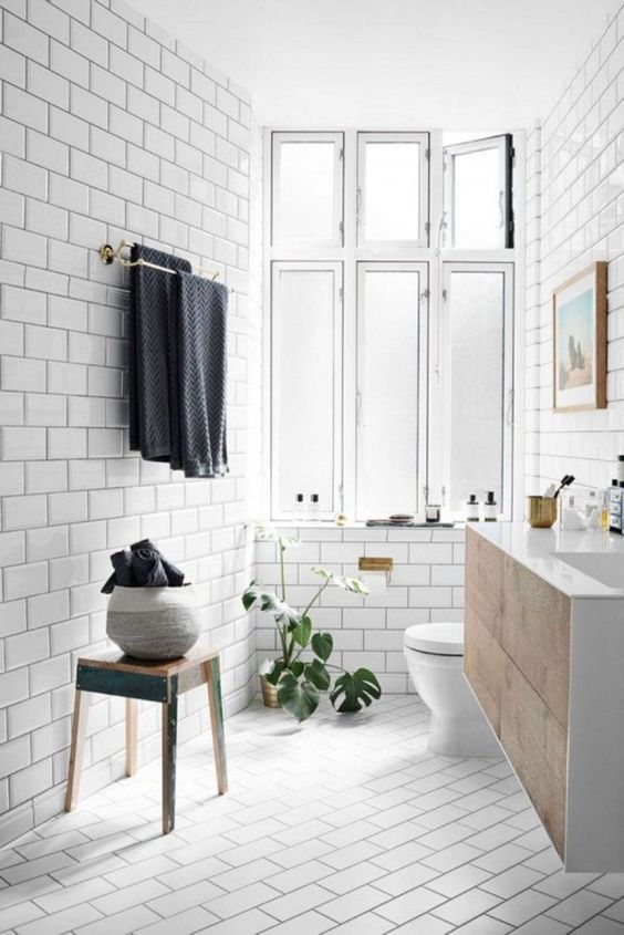 Textured Planter Holds Extra Towels Beside the Sink