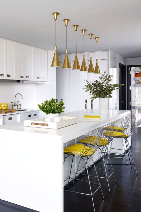 Brass Cone Pendants Add Warm Glow Above Island