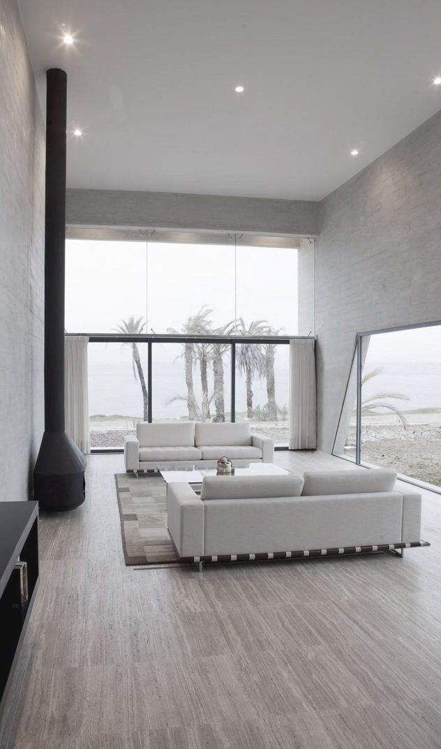 Suspended Black Fireplace Adds a Bold Vertical Element
