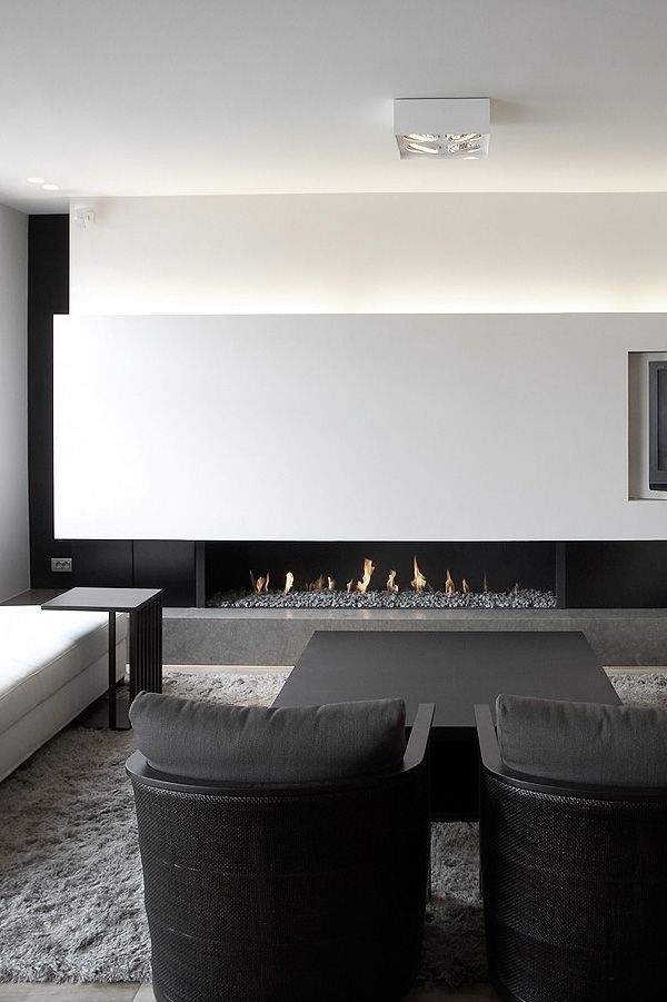 Linear Gas Fireplace With Stone Bed Adds Warmth