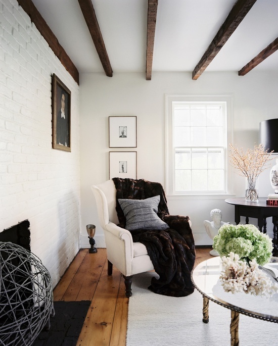 Cream Wingback Chair With Plush Throw Adds Cozy Comfort