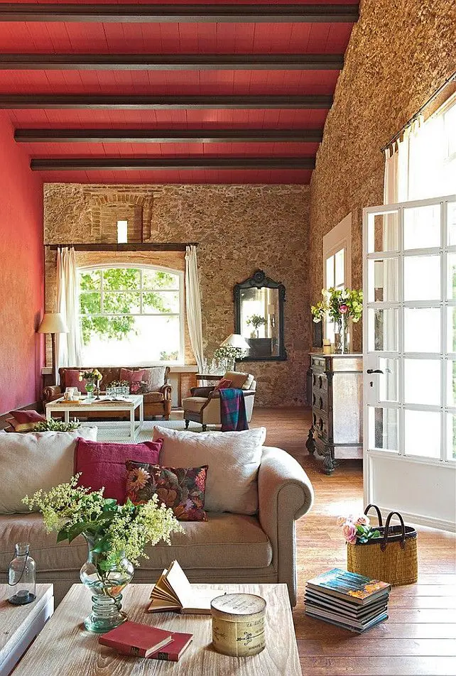 Red Painted Ceiling With Dark Beams Creates Dramatic Contrast