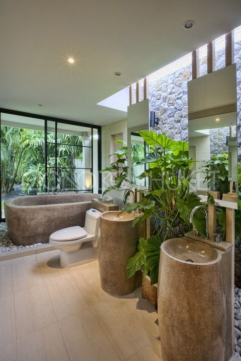 Stone Pedestal Sinks Add Organic Texture to Bathroom